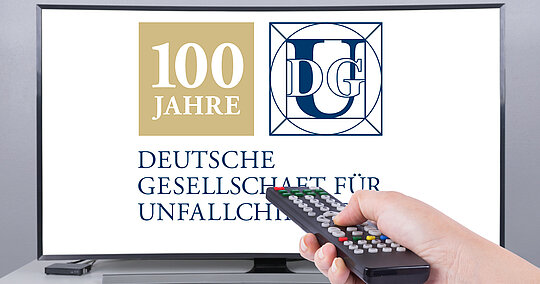 Logo 100 Jahre DGU auf Fernseher